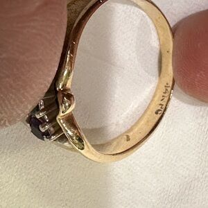 A vintage 14k yellow gold multi-gemstone ring with green and purple stones